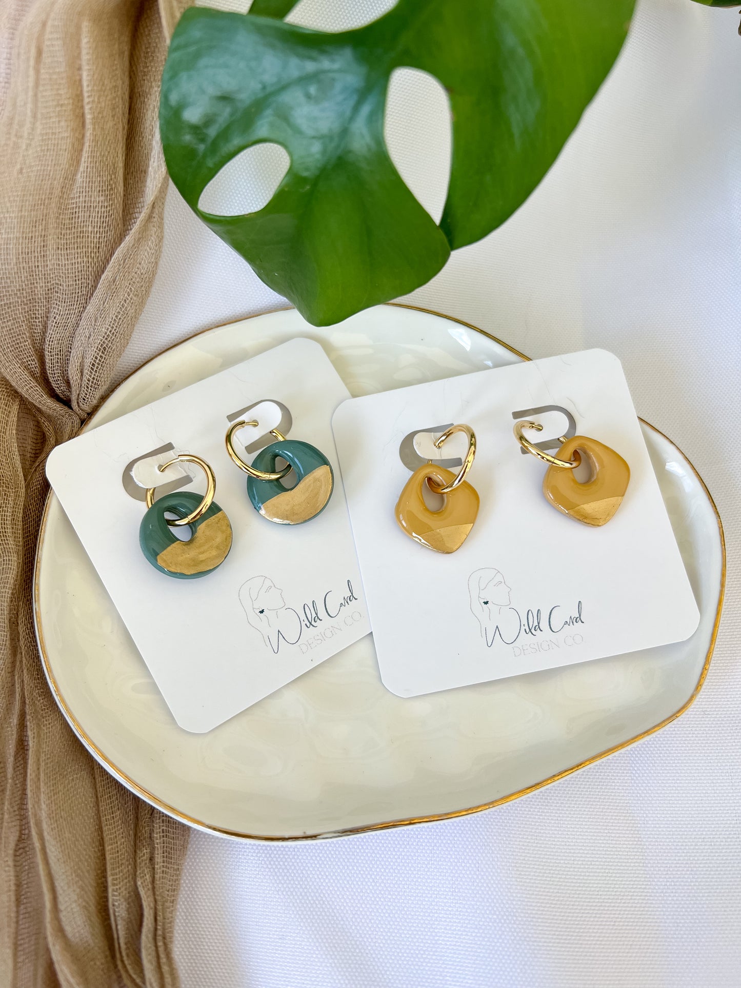 Gold trimmed mini hoops